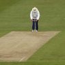 Which Umpire, Currently Active, Took a Wicket with Their First Ball in Test Cricket in 1991?